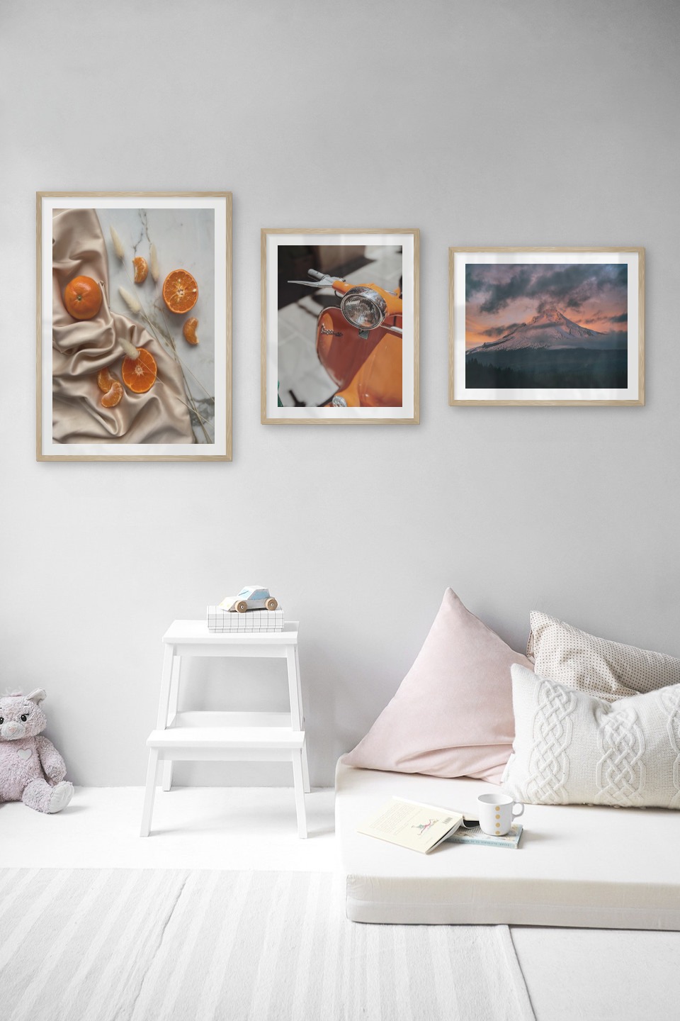 Gallery wall with picture frames in wood in sizes 50x70 and 40x50 with prints "Oranges", "Orange vespa" and "Sunset and mountains"