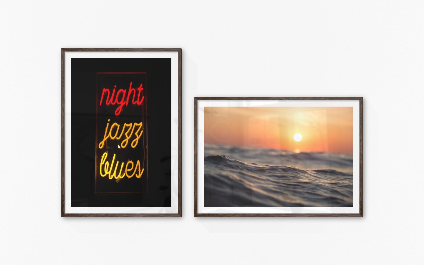 Gallery wall with picture frames in dark wood in sizes 70x100 with prints "Neon signs" and "Waves and the sun"