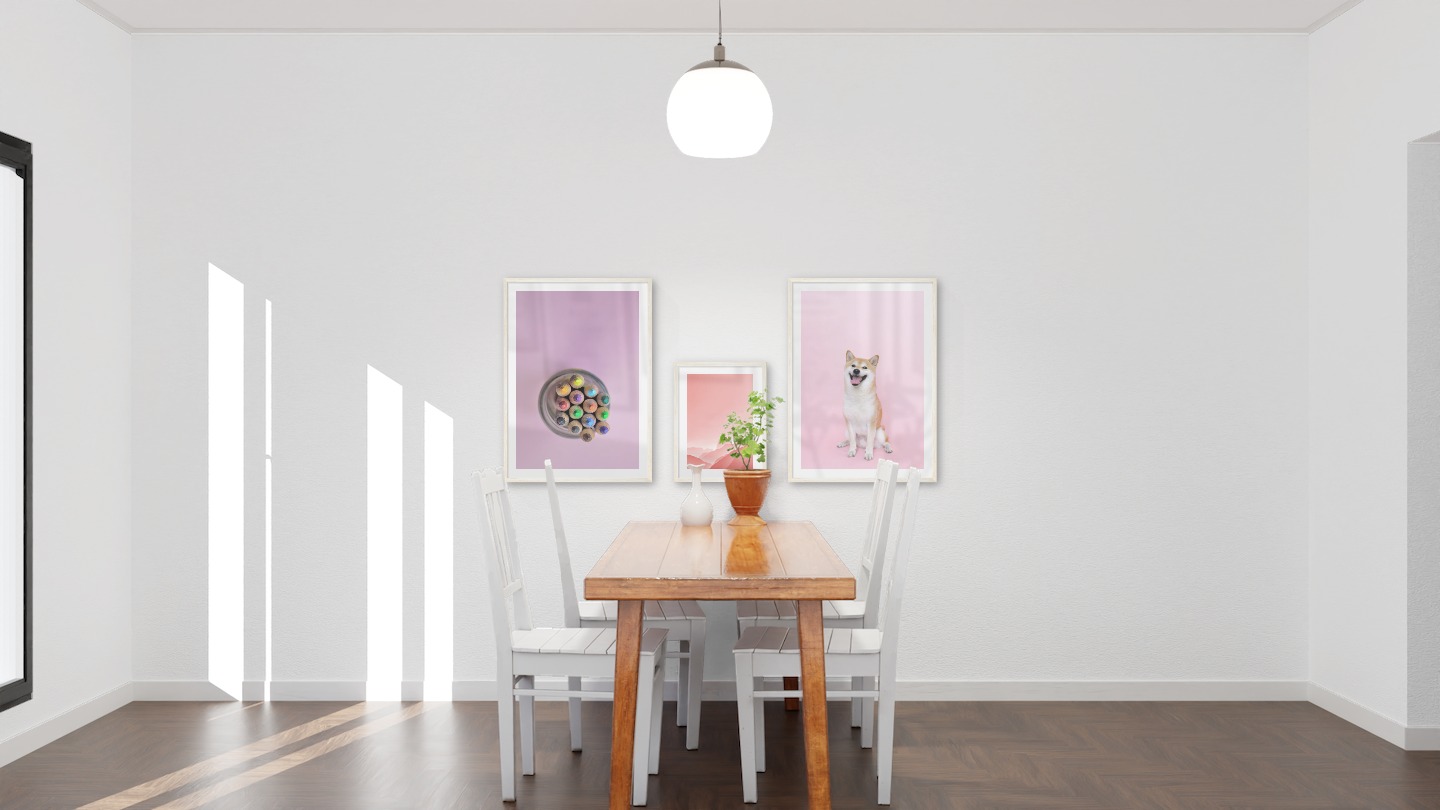 Gallery wall with picture frames in light wood in sizes 50x70 and 30x40 with prints "Canned pens", "Pink sky" and "Dog"