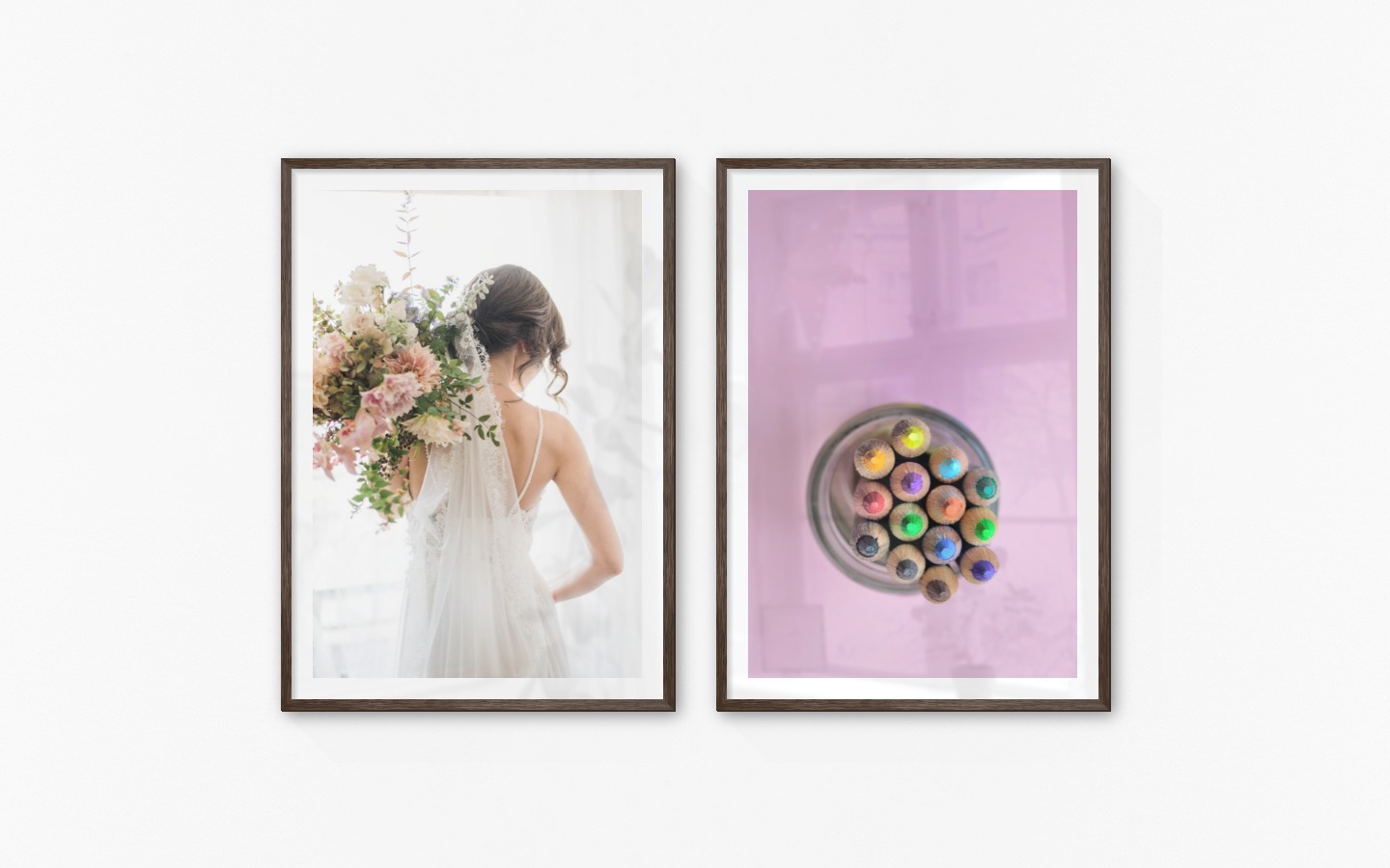Gallery wall with picture frames in dark wood in sizes 70x100 with prints "Bride and flowers" and "Canned pens"