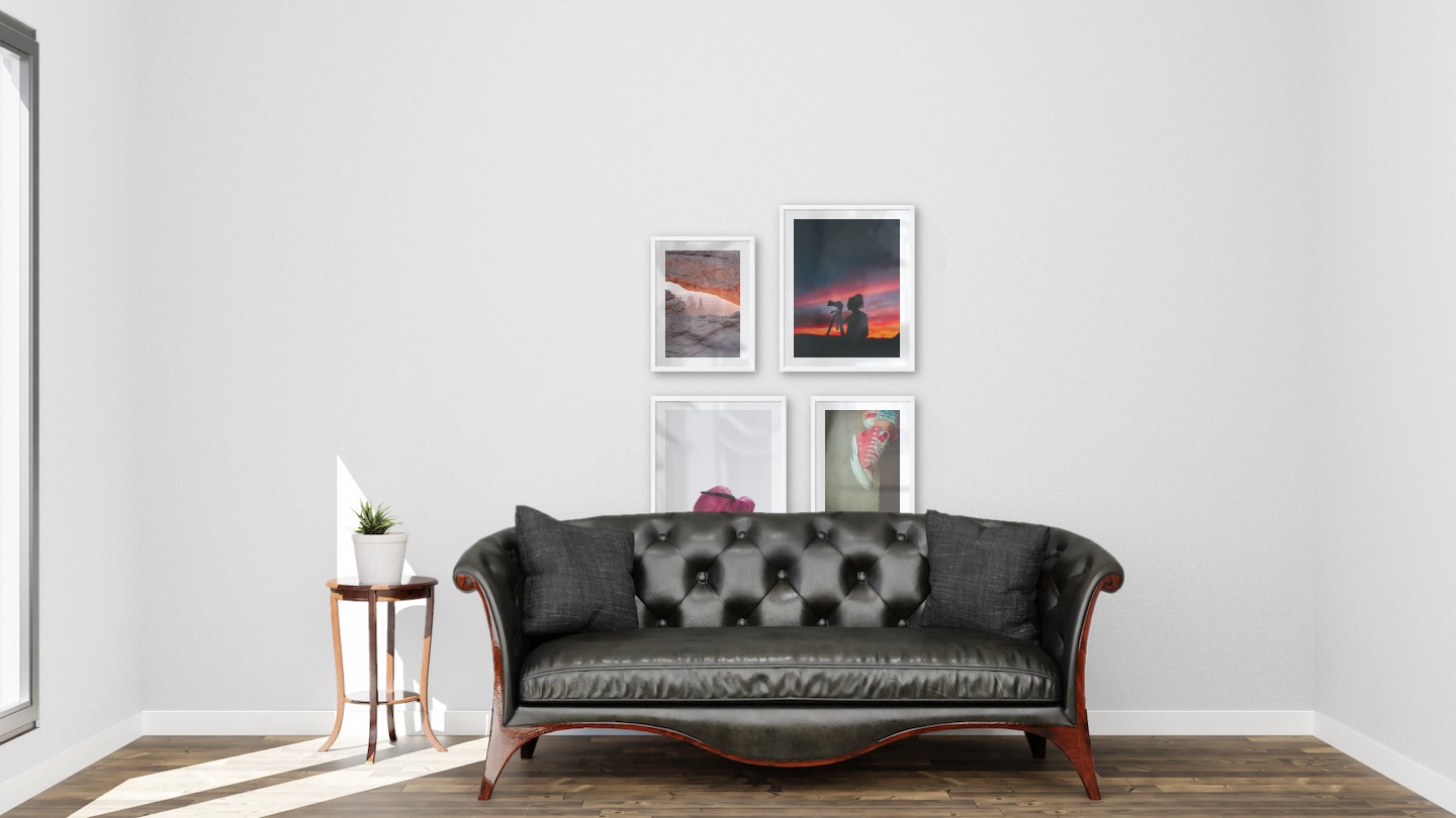 Gallery wall with picture frames in white in sizes 30x40 and 40x50 with prints "View between cliffs", "Photographer at night", "Red flower" and "Red shoes"