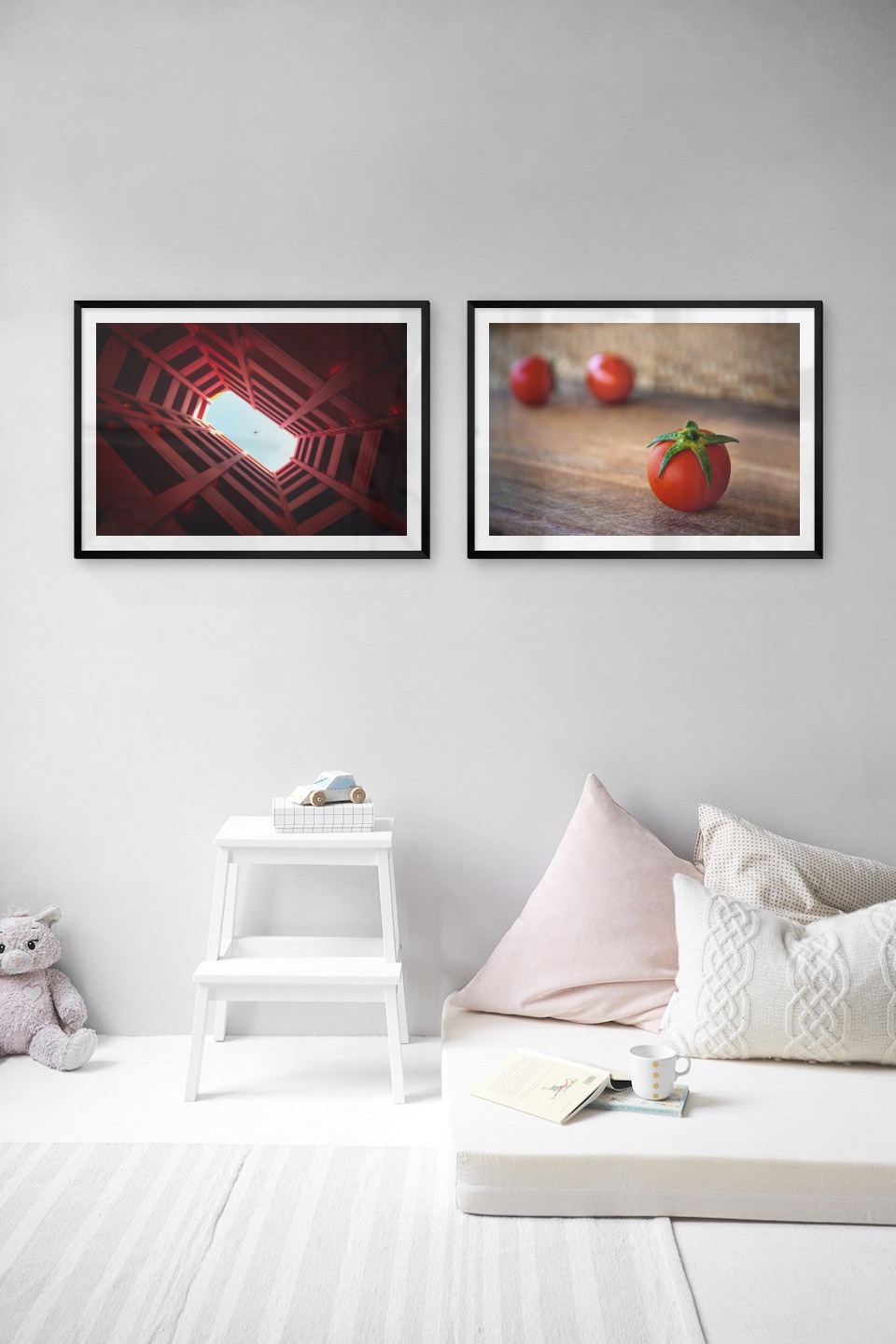 Gallery wall with picture frames in black in sizes 50x70 with prints "Airplane above building" and "Tomatoes"