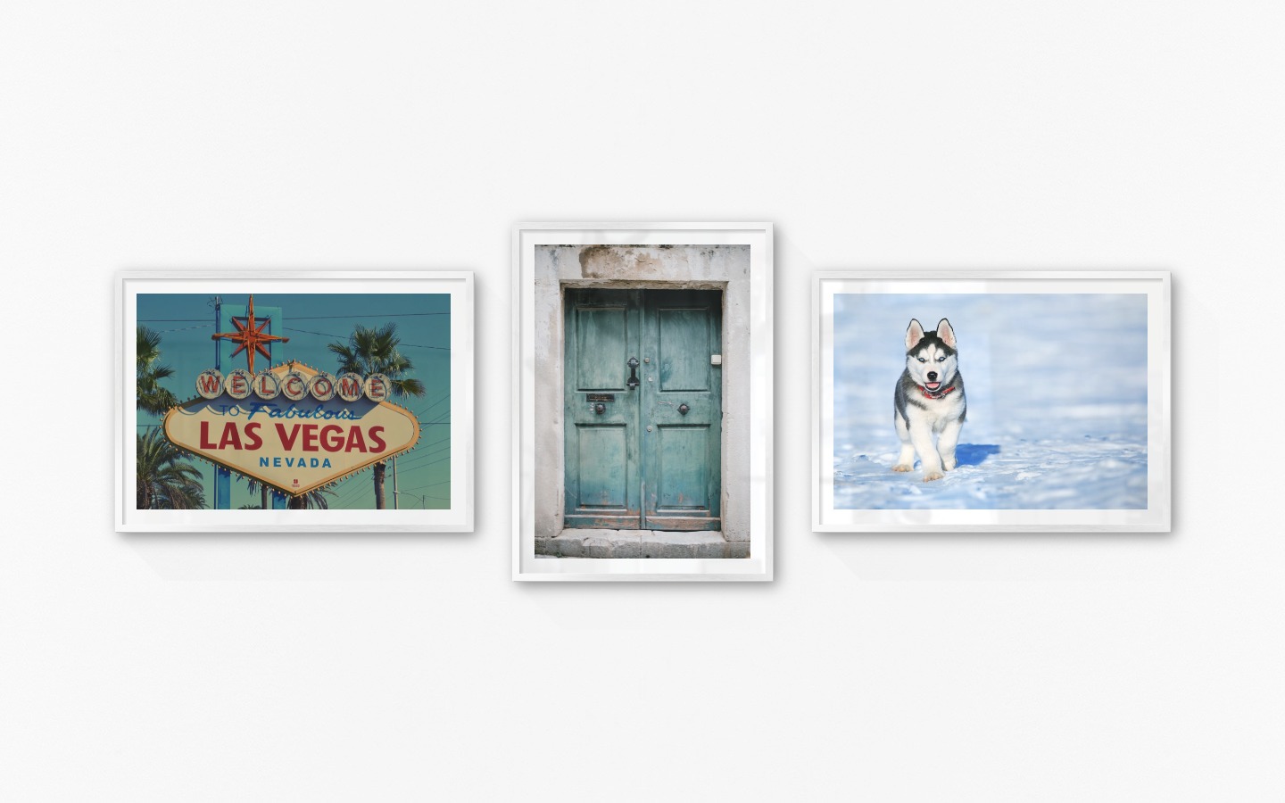 Gallery wall with picture frames in silver in sizes 50x70 with prints "Las Vegas sign", "Door" and "Husky"