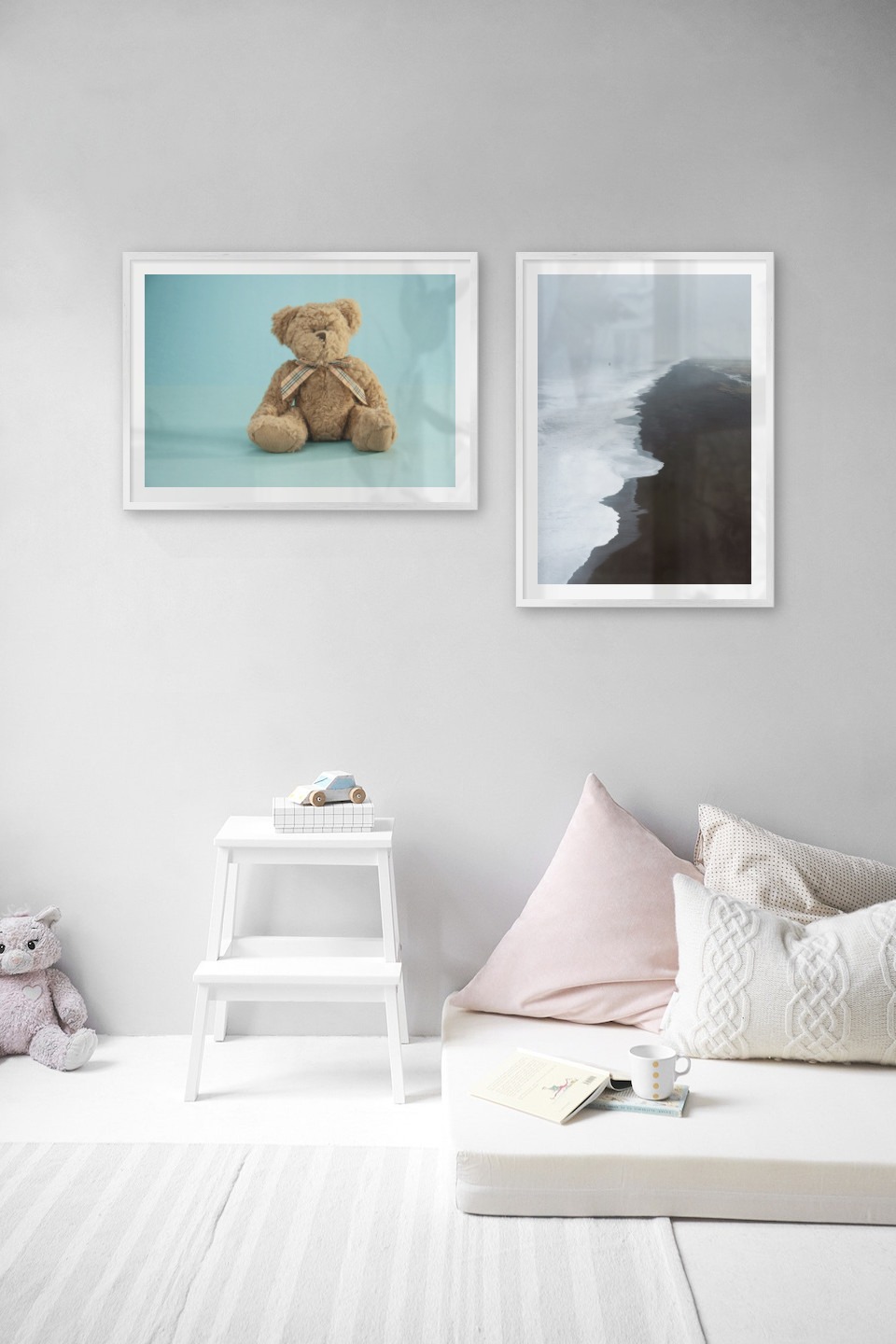 Gallery wall with picture frames in silver in sizes 50x70 with prints "Teddy bear and blue" and "Black beach"