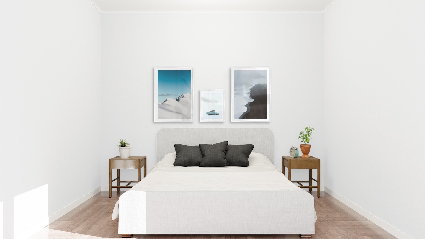 Gallery wall with picture frames in silver in sizes 50x70 and 30x40 with prints "Snowy mountain peaks", "Car in snow" and "Black beach"