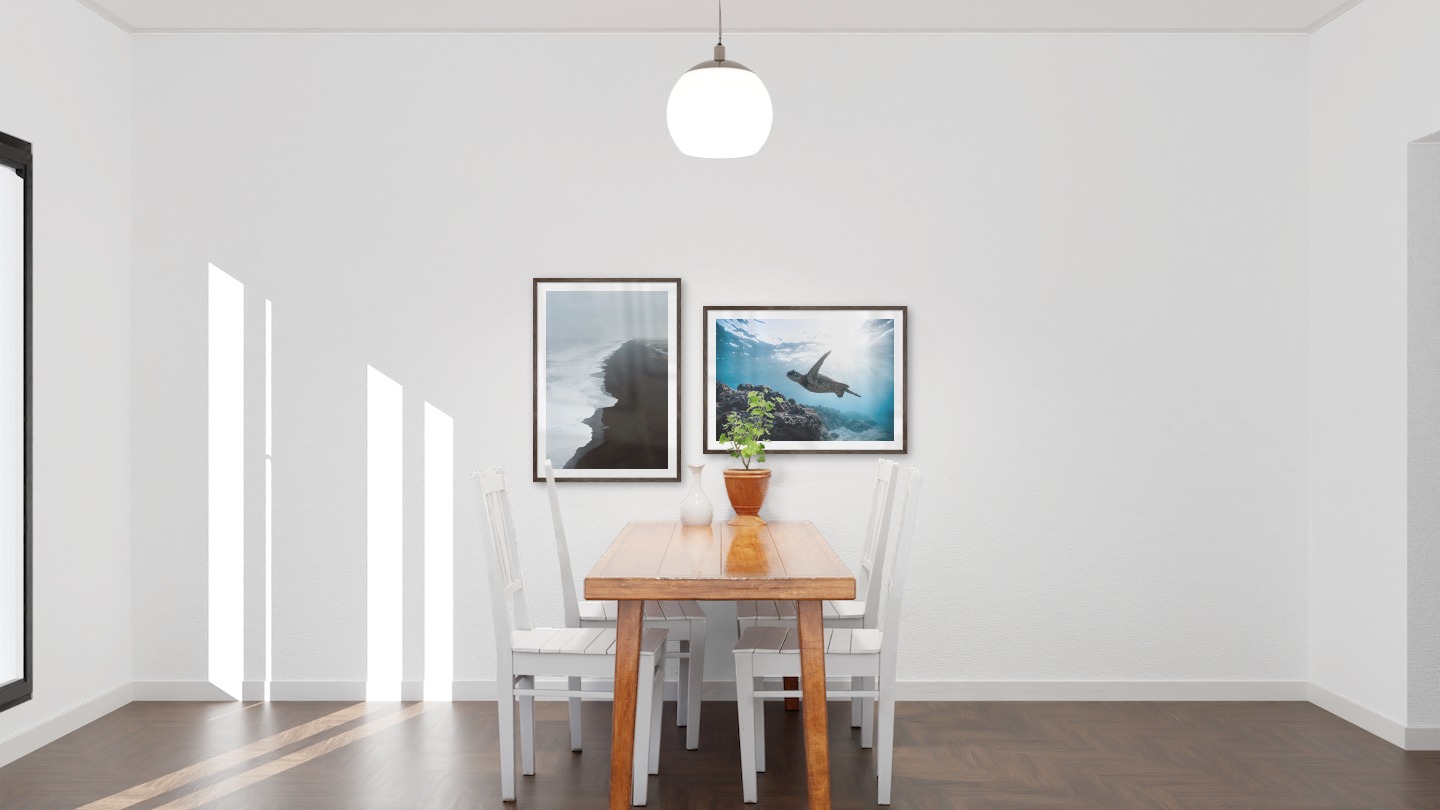 Gallery wall with picture frames in dark wood in sizes 50x70 with prints "Black beach" and "Turtle in the water"