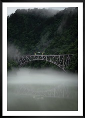 Gallery wall with picture frame in black in size 50x70 with print "Train over bridge"