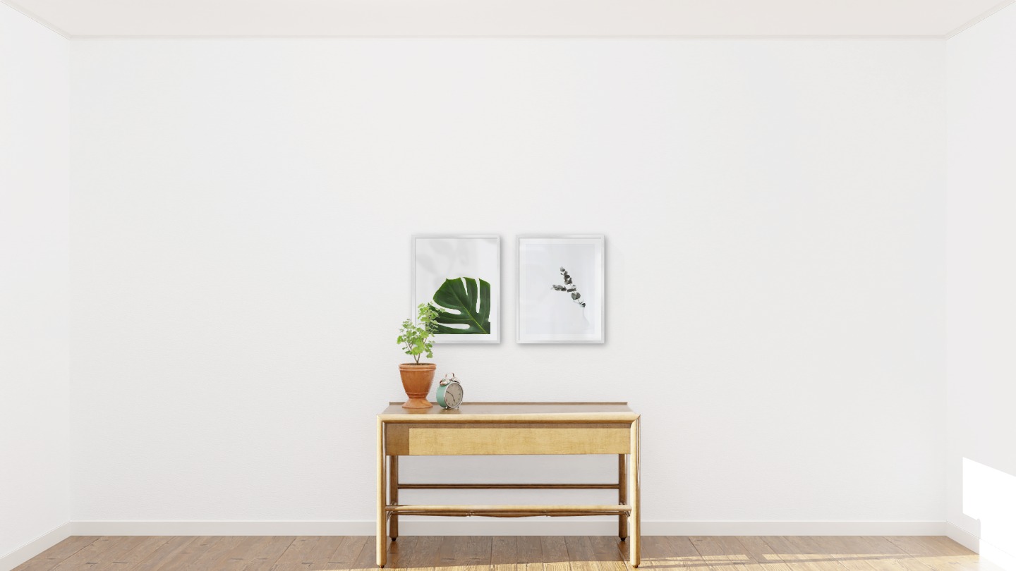 Gallery wall with picture frames in silver in sizes 40x50 with prints "Plant" and "Branch in vase"