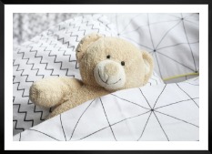 Gallery wall with picture frame in black in size 50x70 with print "Teddy bear in bed"