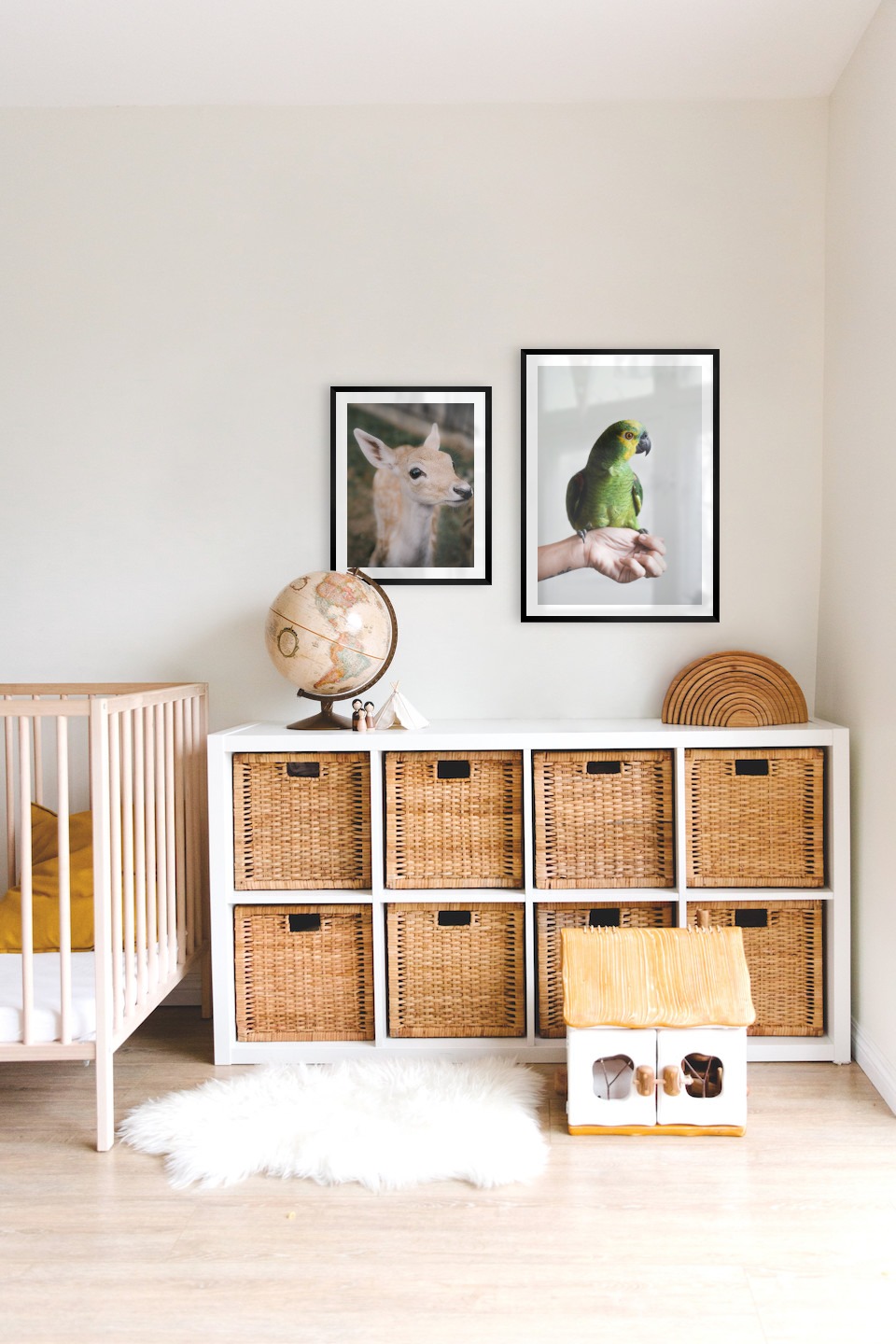 Gallery wall with picture frames in black in sizes 40x50 and 50x70 with prints "Deer" and "Green parrot"