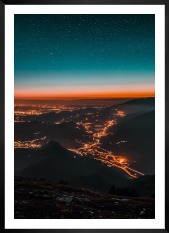 Gallery wall with picture frame in black in size 50x70 with print "City lights on mountains"
