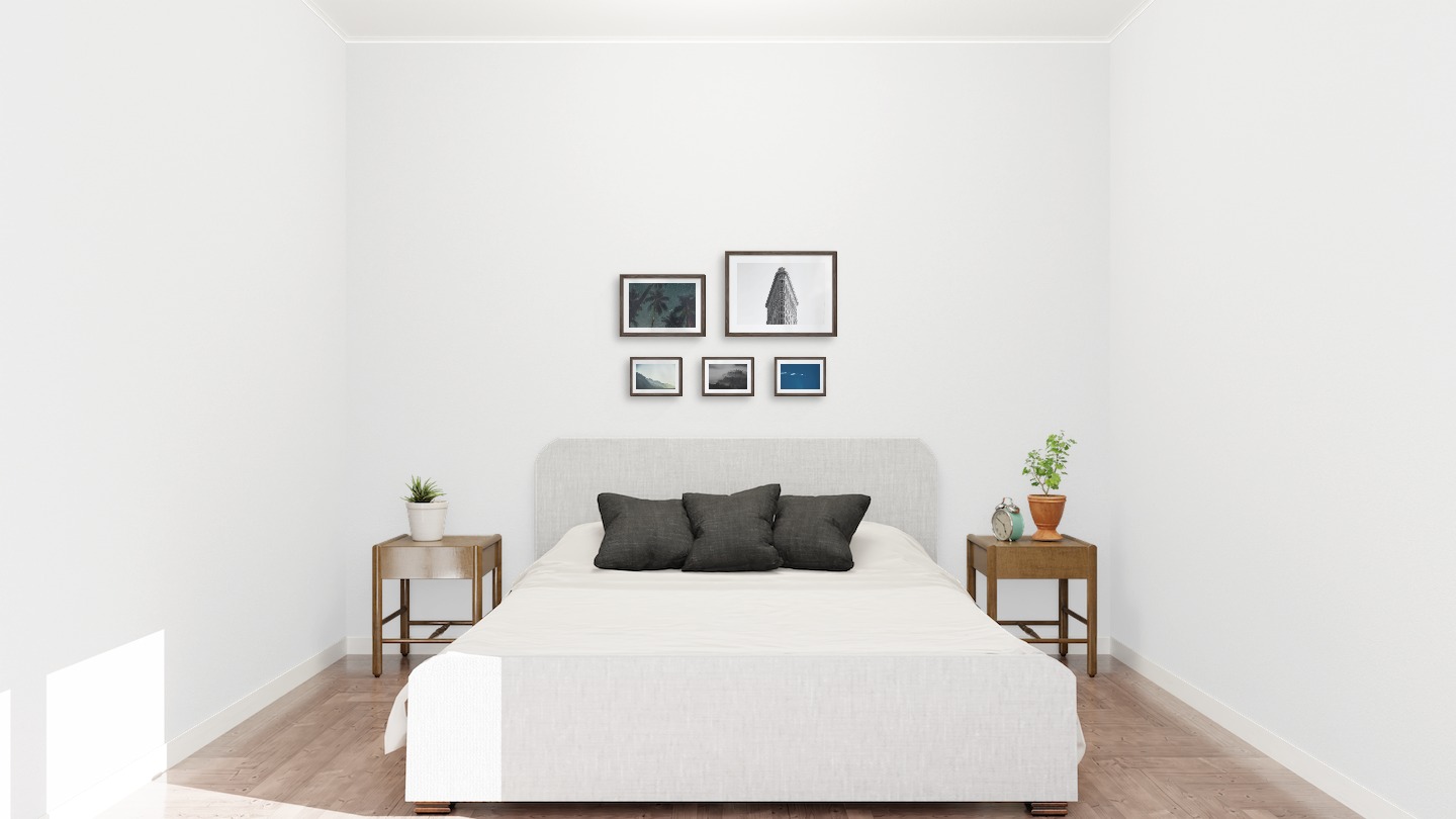 Gallery wall with picture frames in dark wood in sizes 21x30, 30x40 and 13x18 with prints "Palm trees and night sky", "Triangular building", "Foggy mountain", "Foggy wooden tops" and "Airplanes in the air"