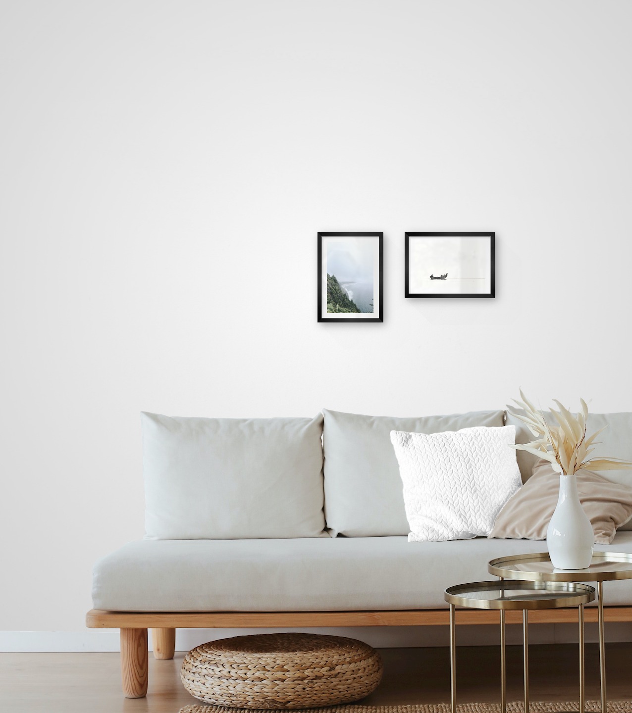 Gallery wall with picture frames in black in sizes 21x30 with prints "Rocks facing the water" and "People in boat"