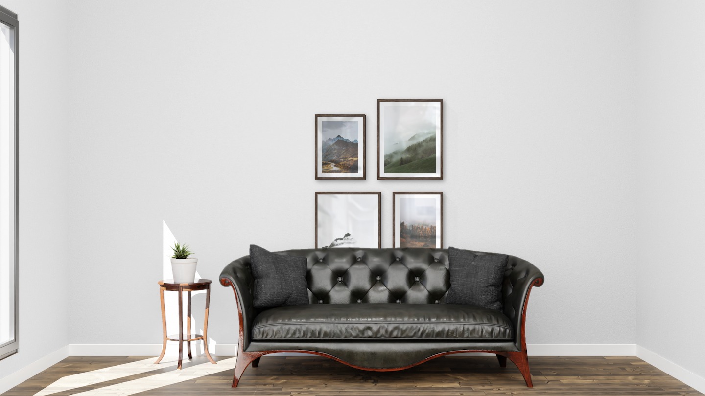 Gallery wall with picture frames in dark wood in sizes 30x40 and 40x50 with prints "Road among the mountains", "Foggy slope", "Mountain peaks in fog" and "Autumn and fog"