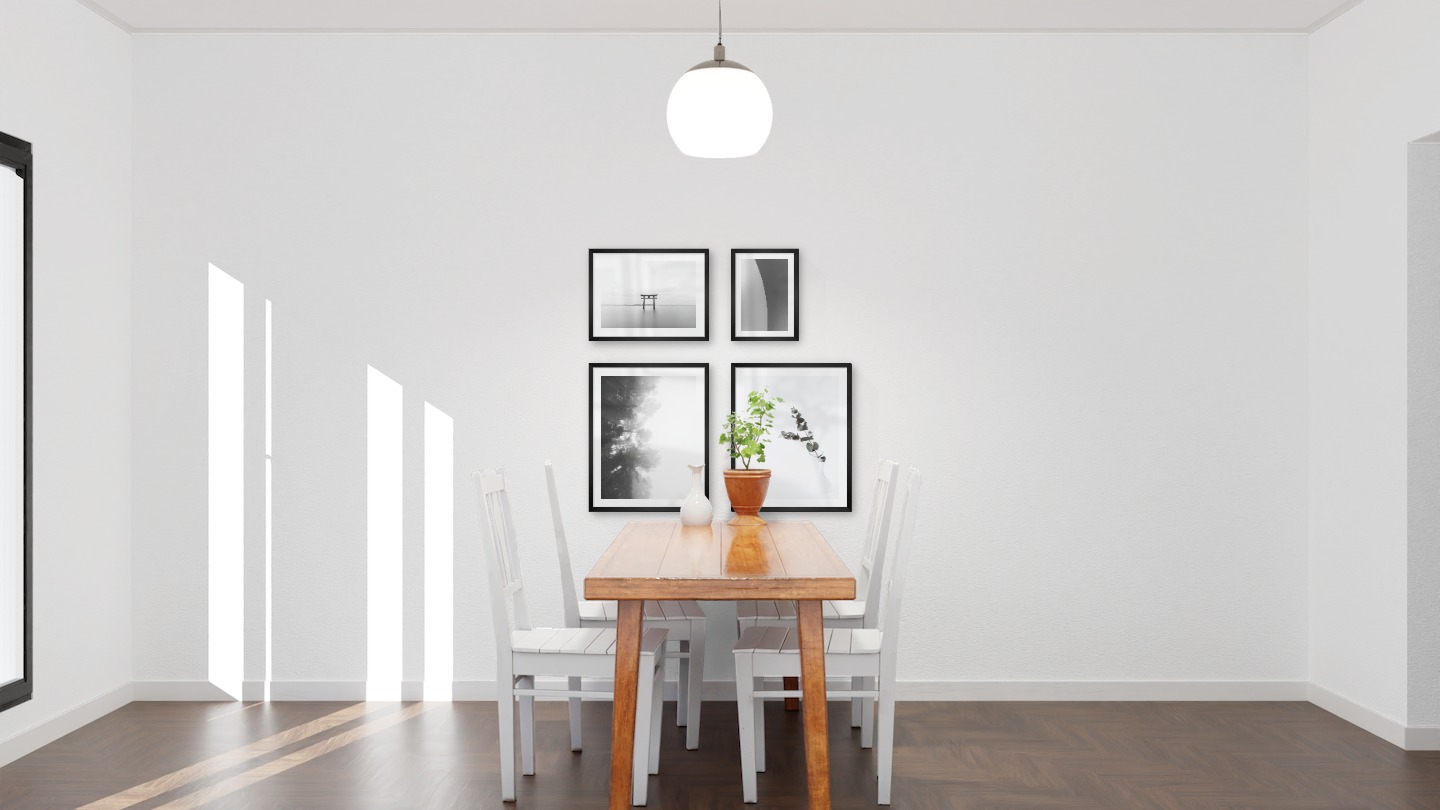 Gallery wall with picture frames in black in sizes 40x50, 30x40 and 21x30 with prints "Foggy wooden tops from the side", "Branch in vase", "Pillars in the water" and "Line"