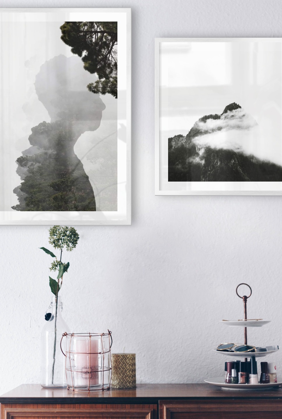 Gallery wall with picture frames in silver in sizes 50x70 and 50x50 with prints "Silhouette and tree" and "Mountain peaks in fog"