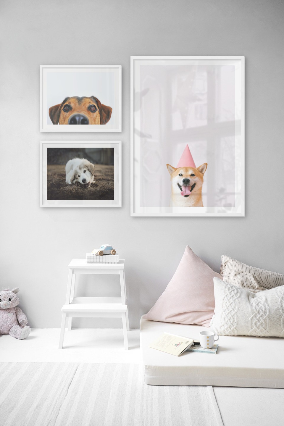 Gallery wall with picture frames in white in sizes 40x50 and 70x100 with prints "Hundnos", "Dog chewing" and "Dog with pink hat"
