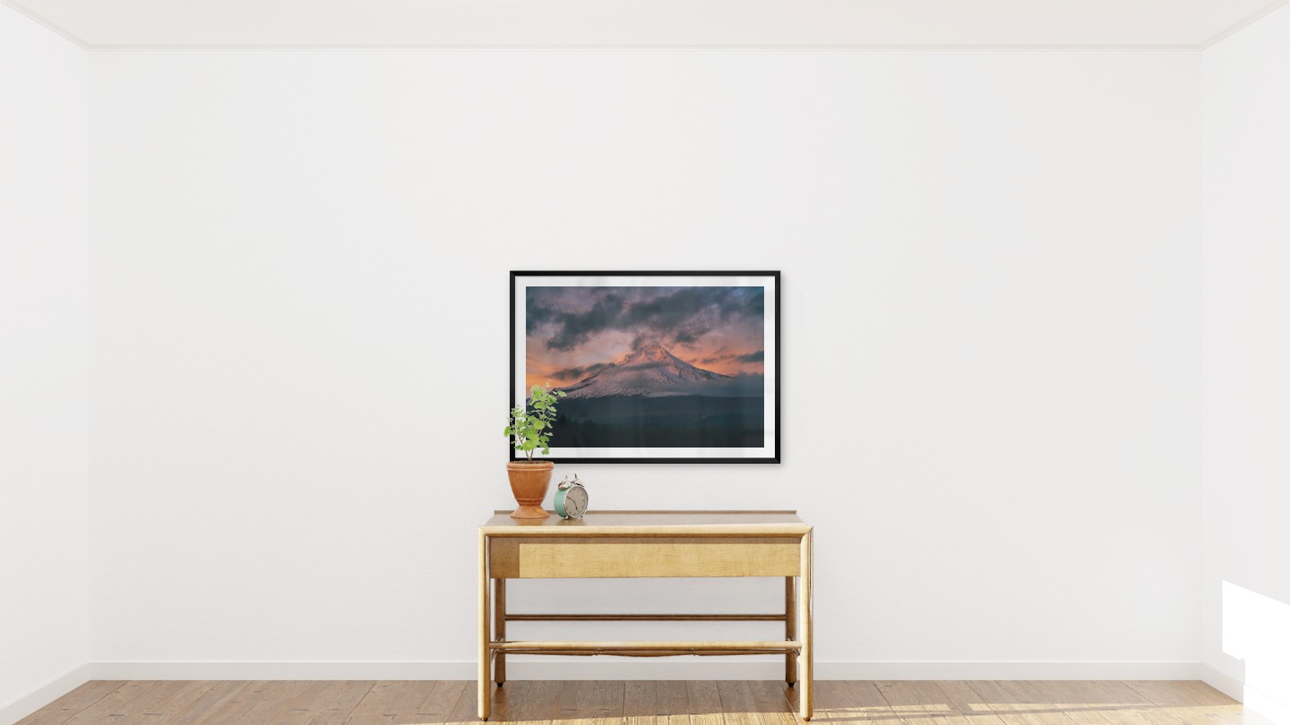 Gallery wall with picture frame in black in size 70x100 with print "Sunset and mountains"