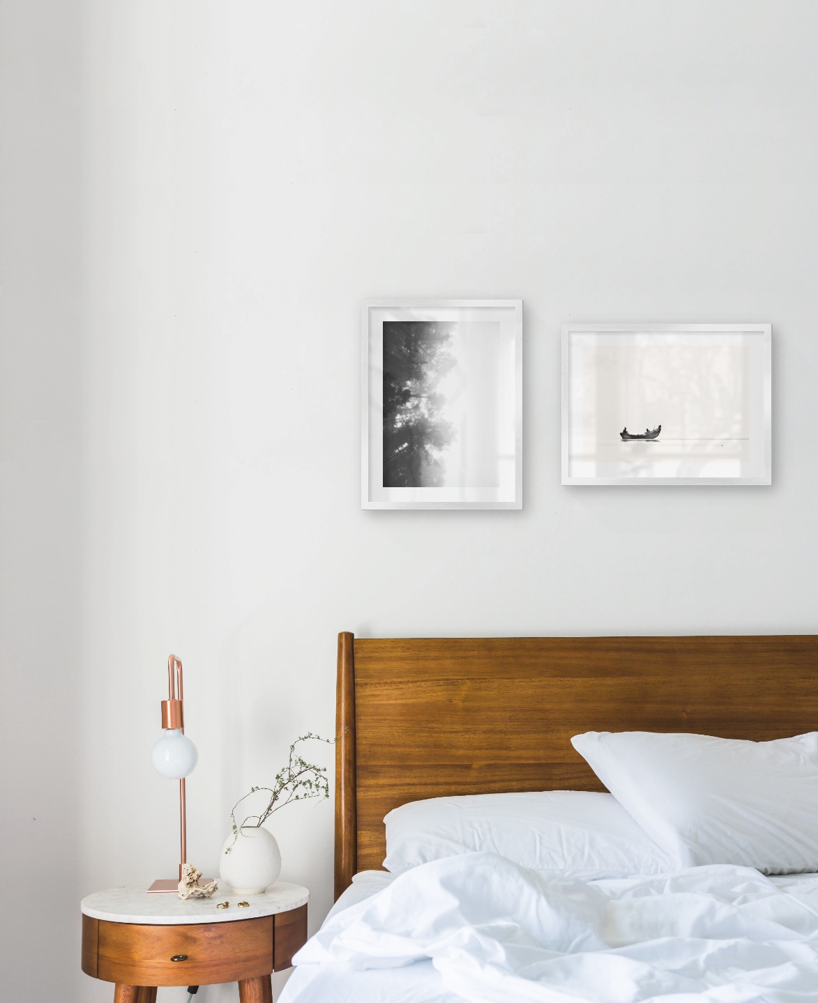 Gallery wall with picture frames in silver in sizes 30x40 with prints "Foggy wooden tops from the side" and "People in boat"