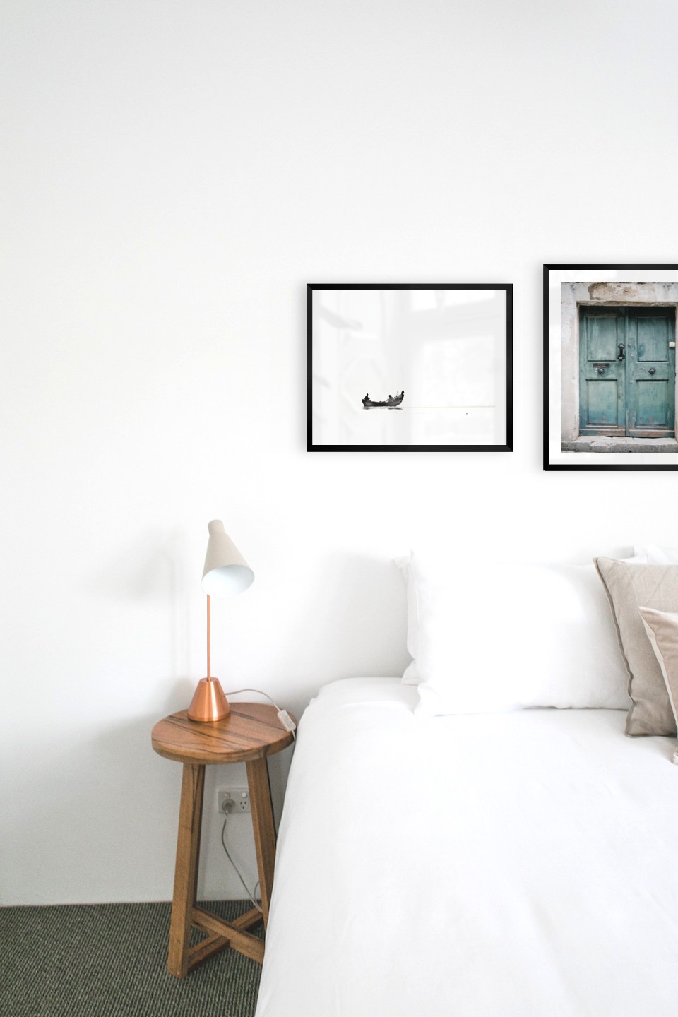 Gallery wall with picture frames in black in sizes 40x50 with prints "People in boat" and "Door"