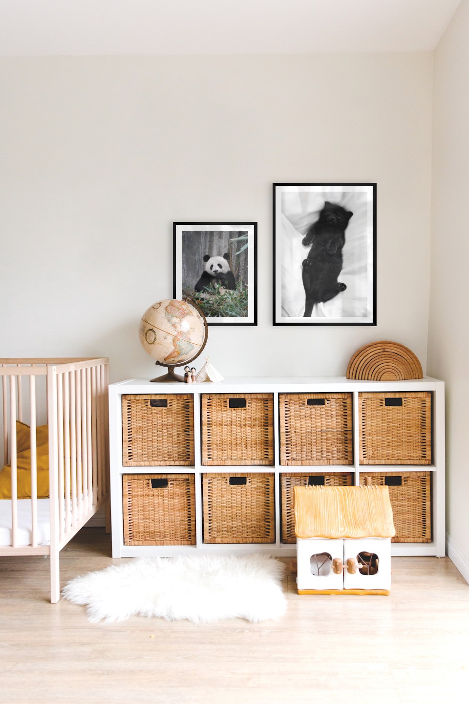 Gallery wall with picture frames in black in sizes 40x50 and 50x70 with prints "Panda" and "Cat in bed"