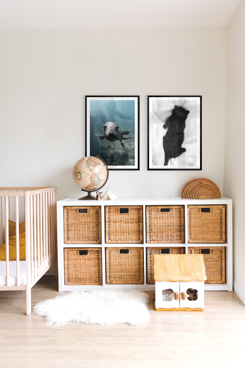 Gallery wall with picture frames in black in sizes 50x70 with prints "Seal in the water" and "Cat in bed"