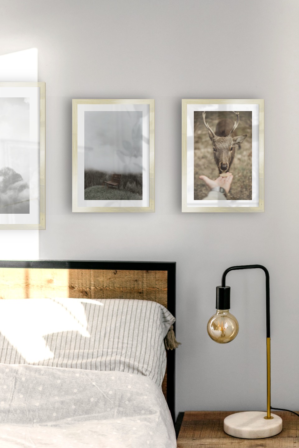 Gallery wall with picture frames in gold in sizes 30x40 and 21x30 with prints "Trees and mountains in fog", "Bench in misty nature" and "Feed a deer"
