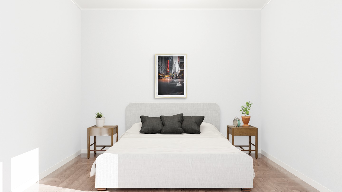 Gallery wall with picture frame in gold in size 50x70 with print "Busy city center"
