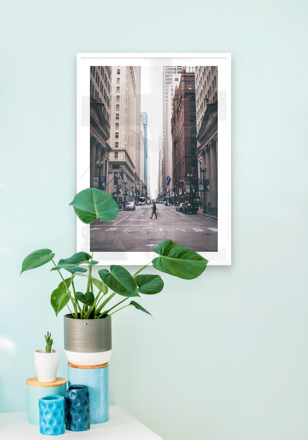 Gallery wall with picture frame in white in size 50x70 with print "Man walking across the street"