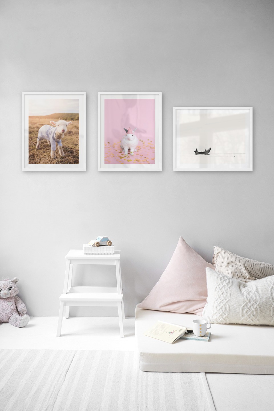 Gallery wall with picture frames in white in sizes 40x50 with prints "Lamb", "Rabbit with party hat" and "People in boat"