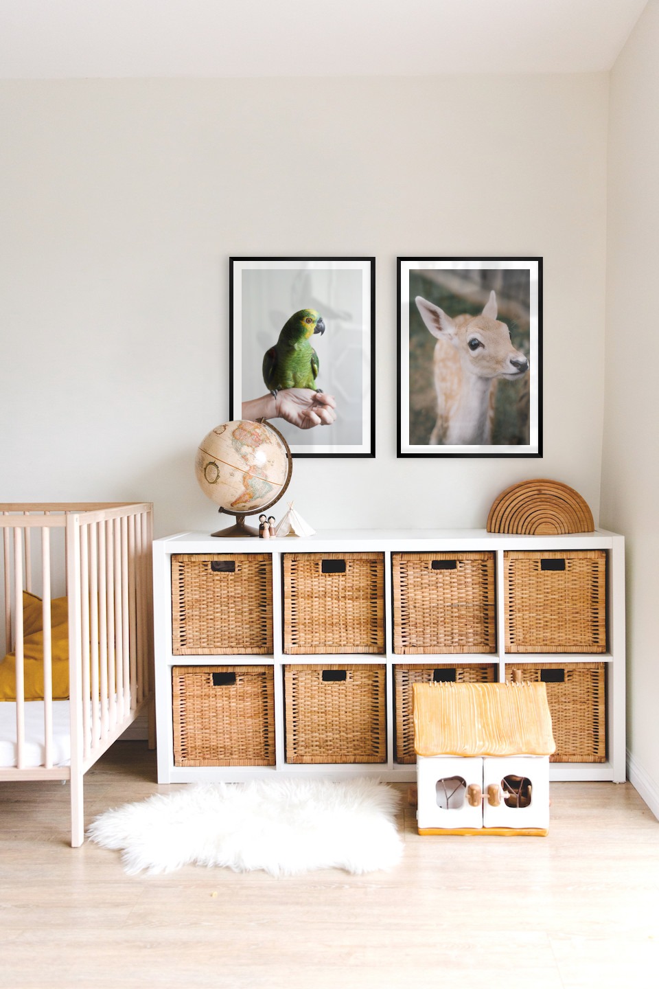 Gallery wall with picture frames in black in sizes 50x70 with prints "Green parrot" and "Deer"