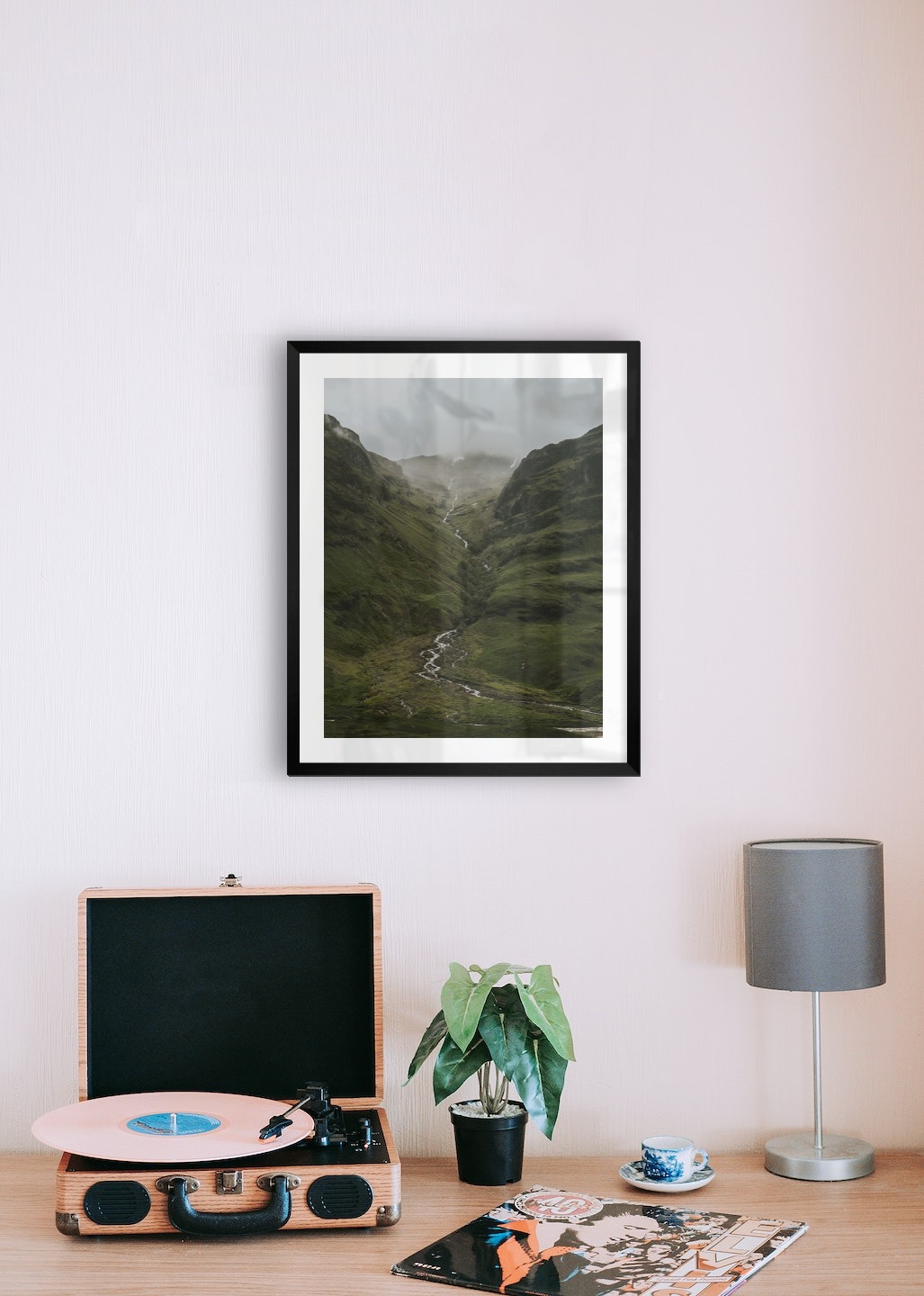 Gallery wall with picture frame in black in size 40x50 with print "Stream in valley"