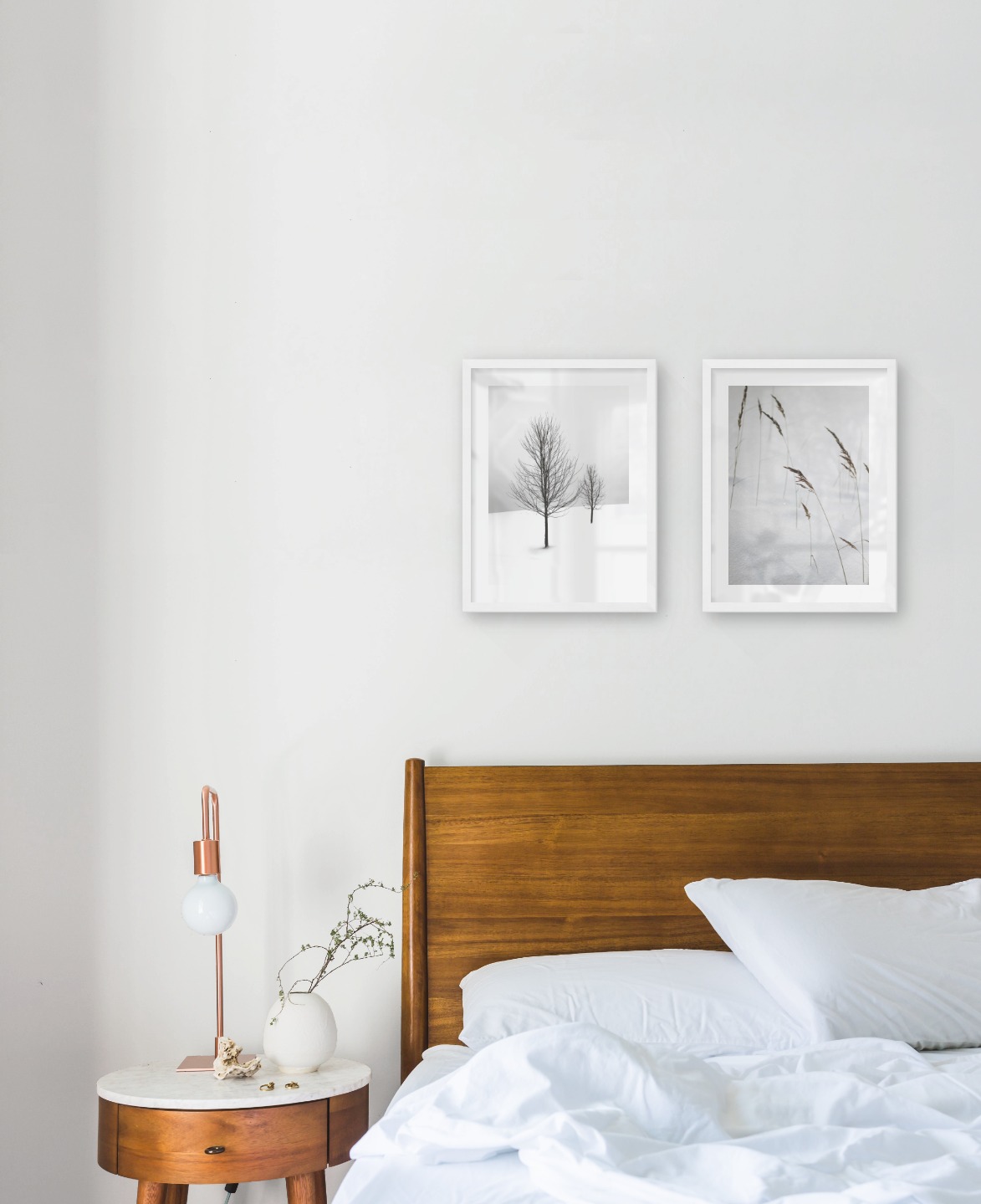 Gallery wall with picture frames in white in sizes 30x40 with prints "Trees in the snow" and "Sharp in the snow"
