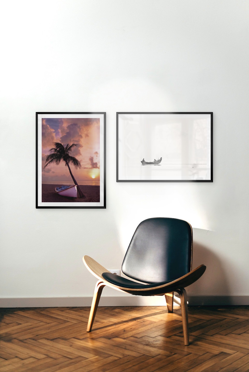 Gallery wall with picture frames in black in sizes 50x70 with prints "Palm on the beach" and "People in boat"