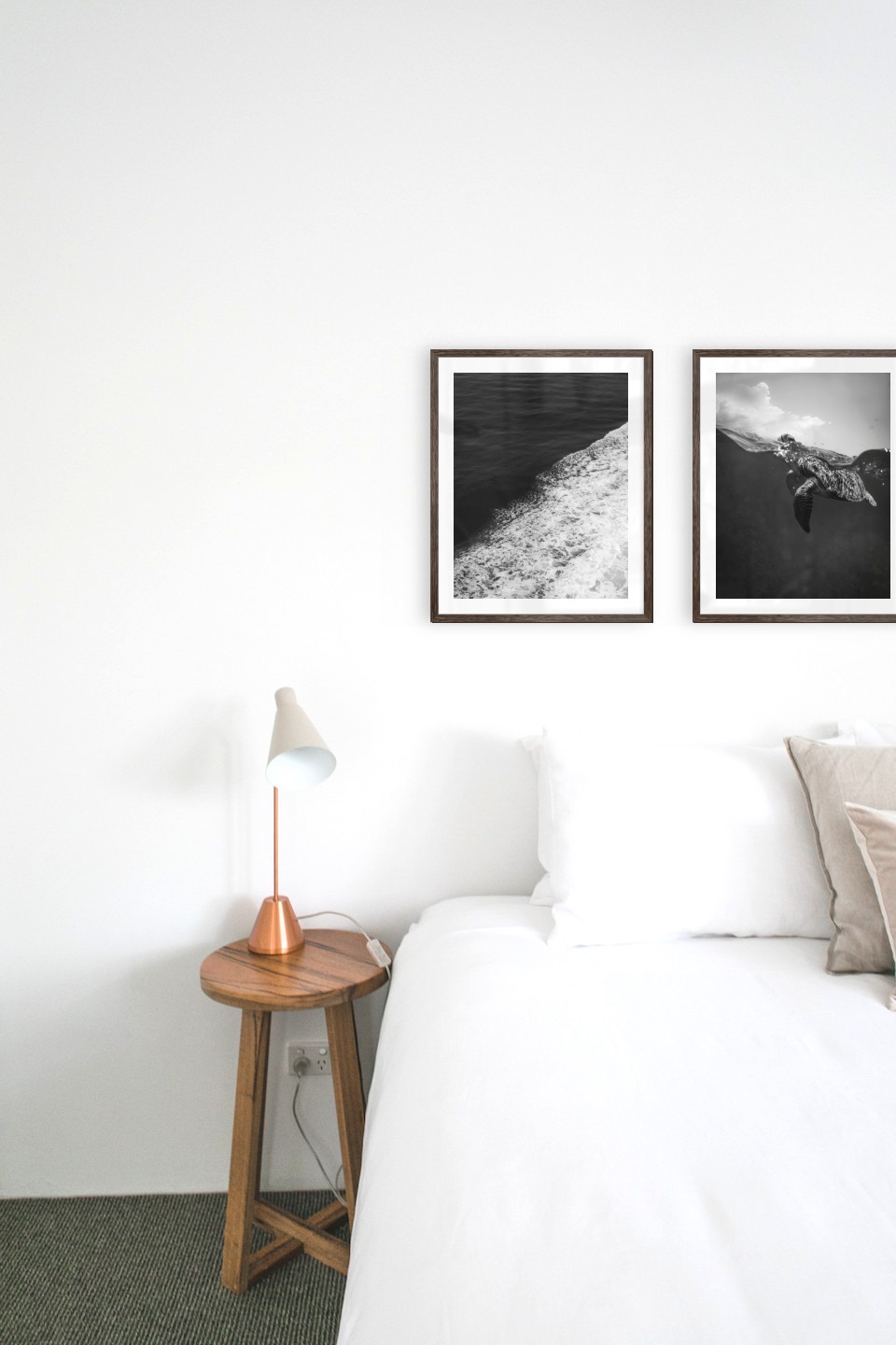Gallery wall with picture frames in dark wood in sizes 40x50 with prints "Swell from waves" and "Turtle"