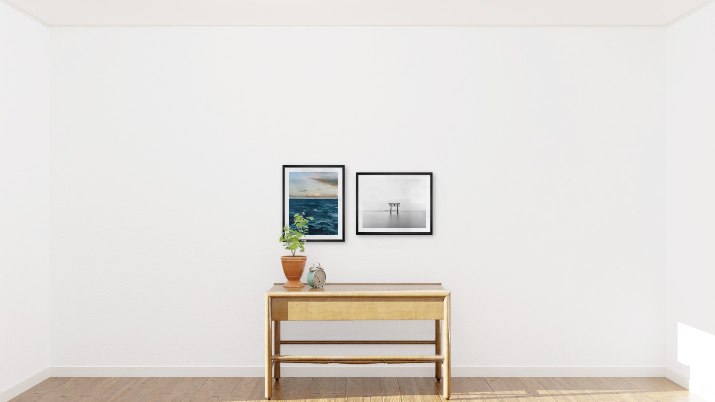 Gallery wall with picture frames in black in sizes 40x50 with prints "Somewhat out at sea" and "Pillars in the water"