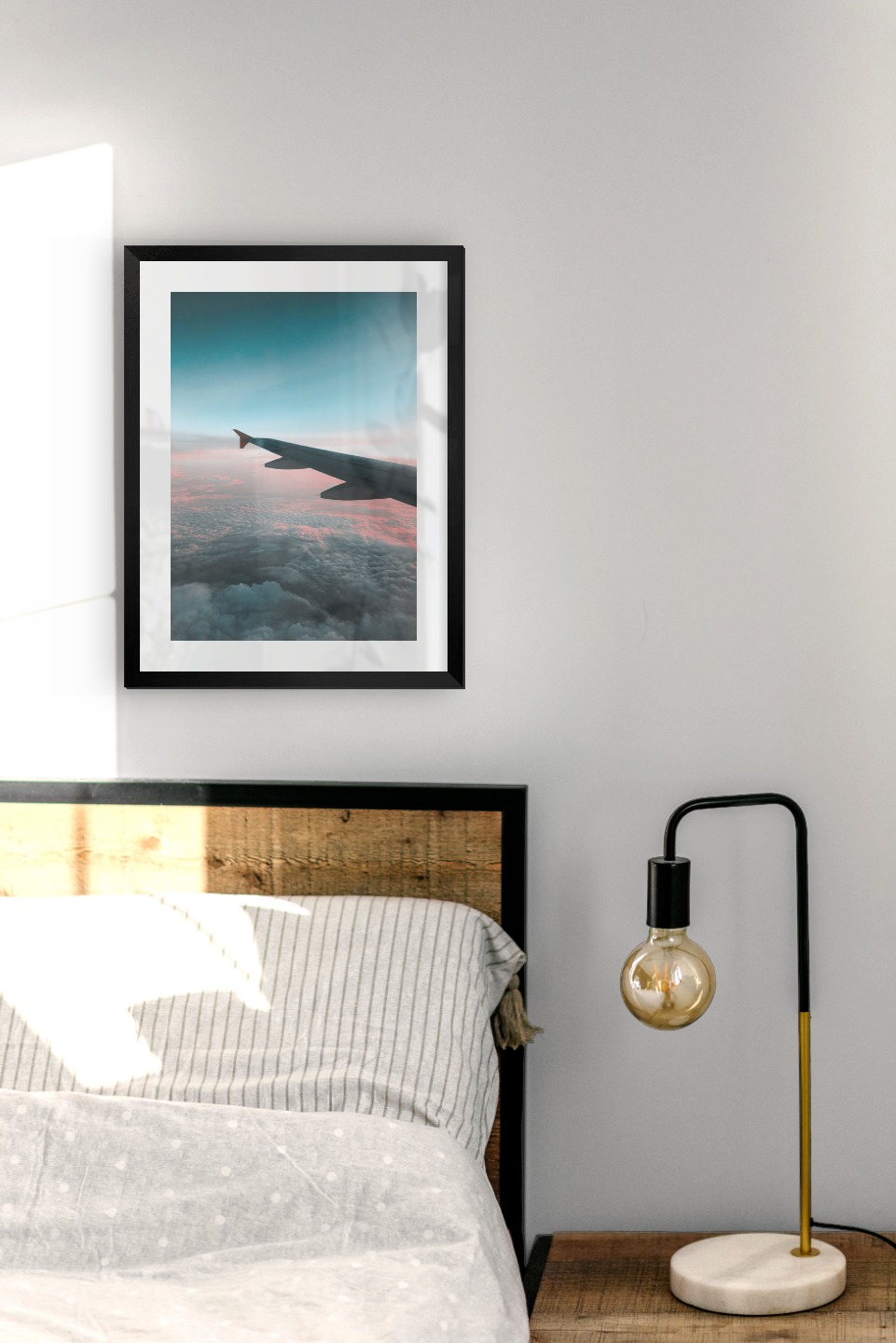 Gallery wall with picture frame in black in size 30x40 with print "Above the clouds"