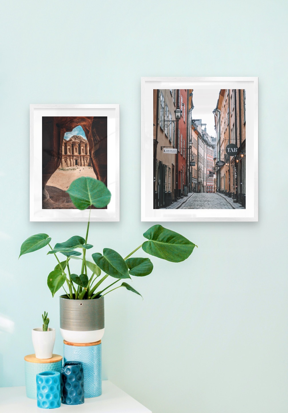 Gallery wall with picture frames in silver in sizes 30x40 and 40x50 with prints "Petra in Jordan" and "Old town in Stockholm"