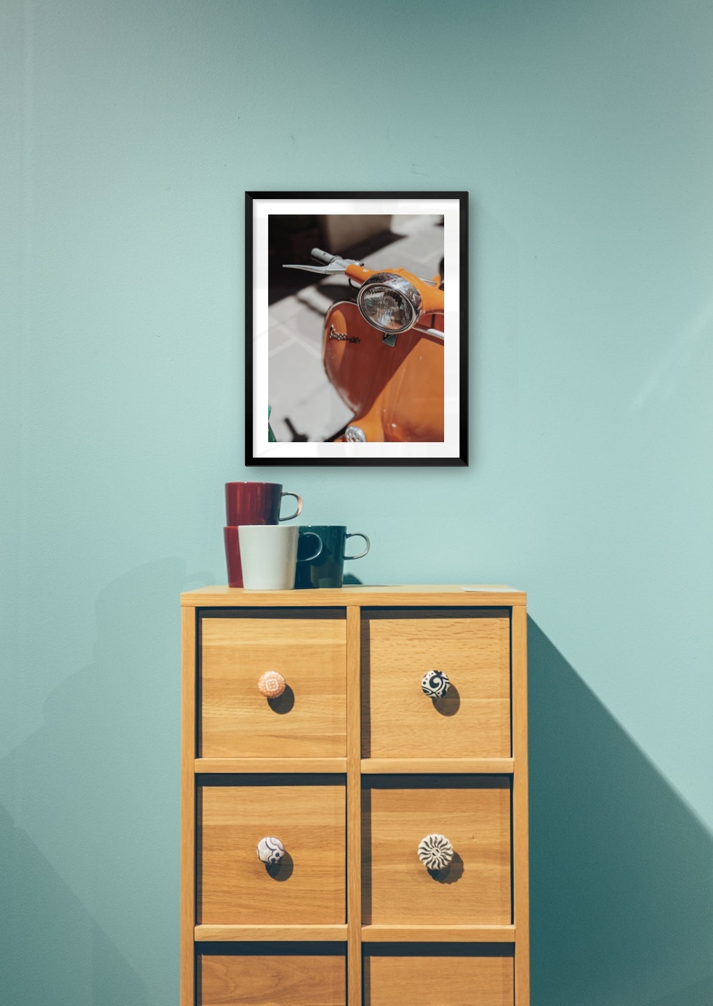 Gallery wall with picture frame in black in size 40x50 with print "Orange vespa"