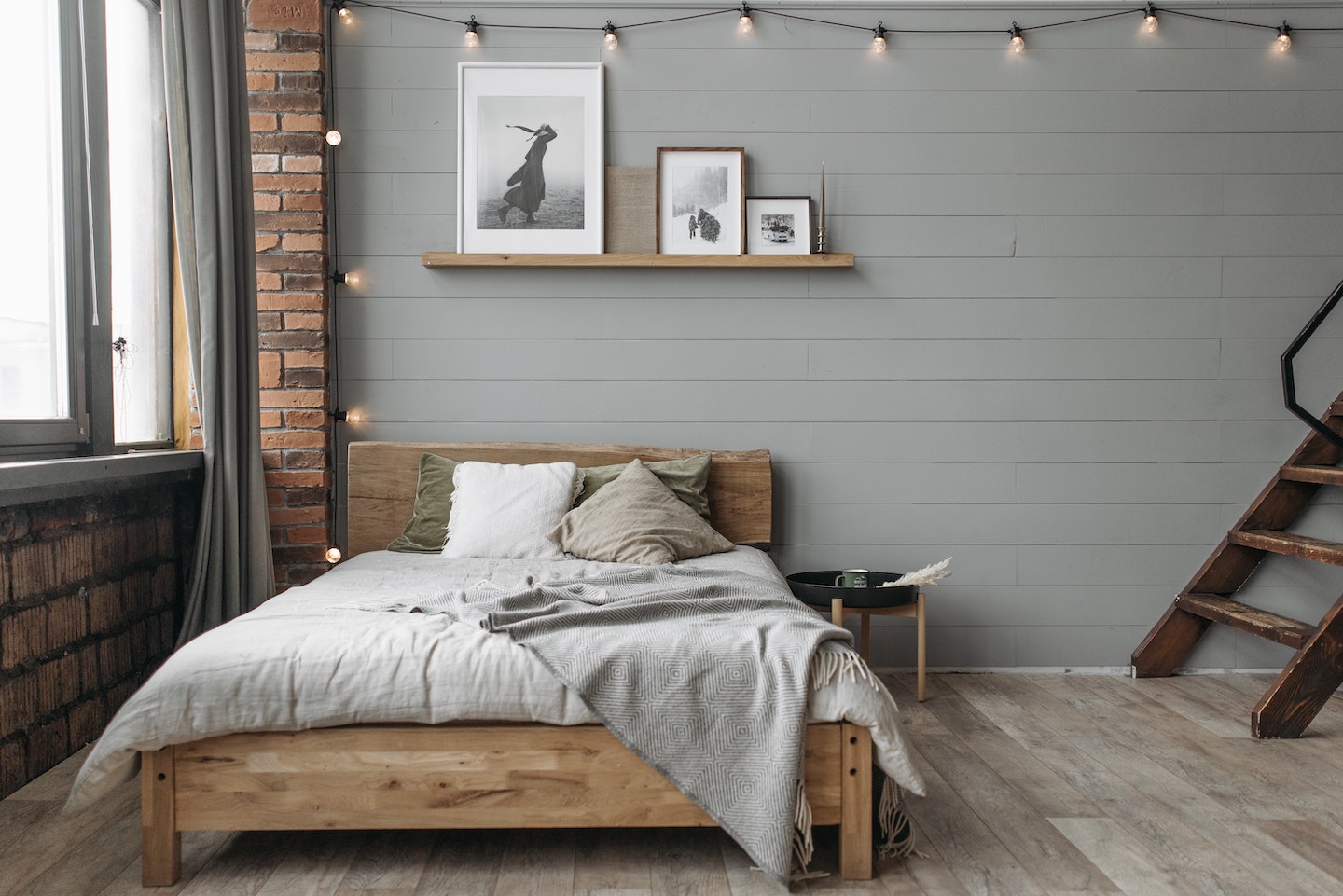 Bedroom with shelf and picture frames in different colors and sizes