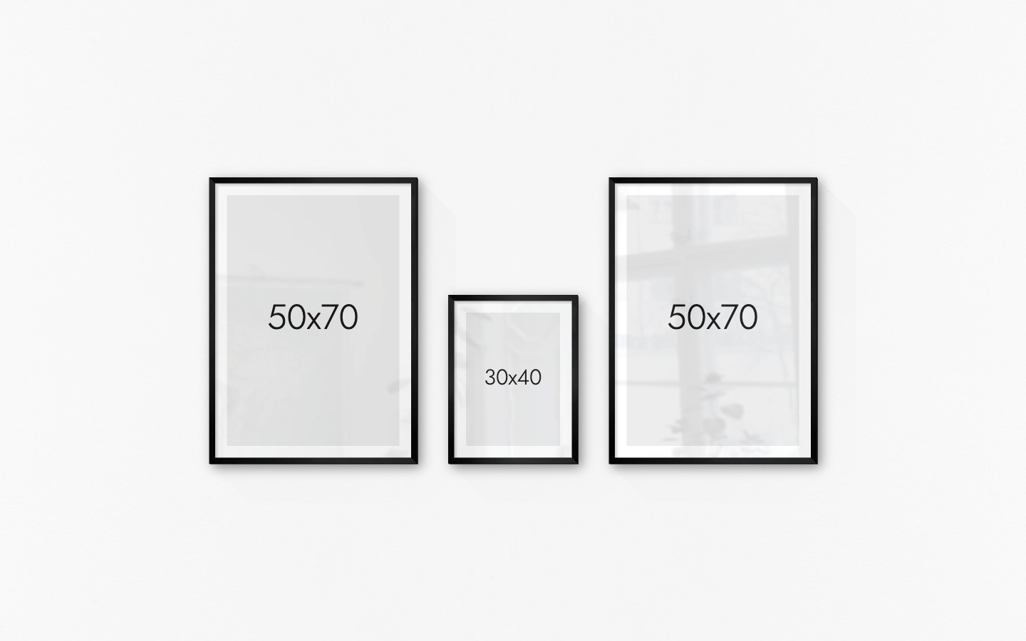 Gallery wall with picture frames in black in sizes 50x70 and 30x40