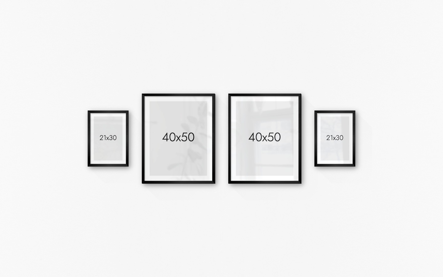 Gallery wall with picture frames in black in sizes 21x30 and 40x50