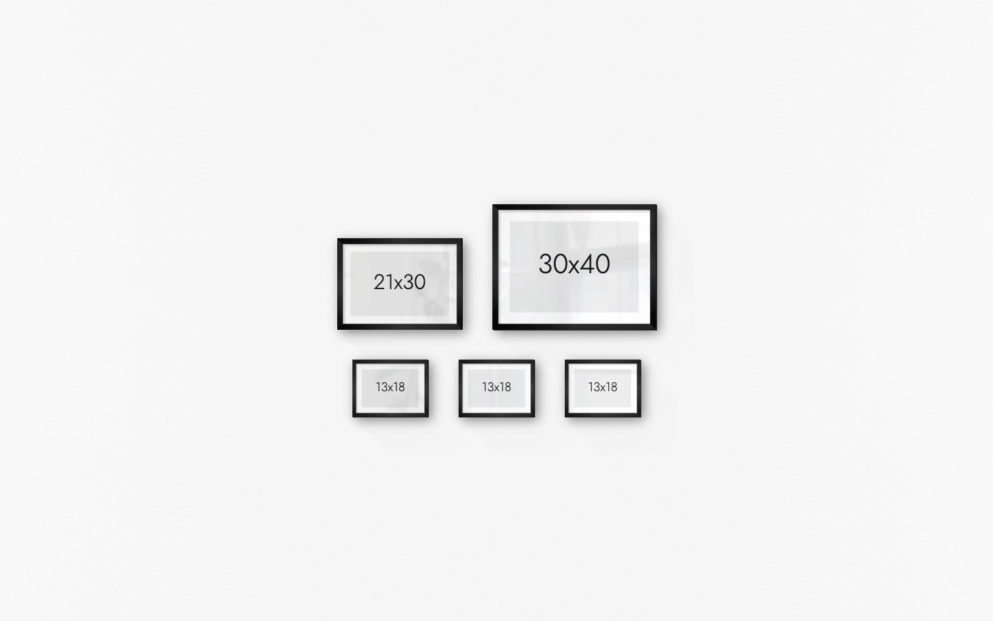 Gallery wall with picture frames in black in sizes 21x30, 30x40 and 13x18