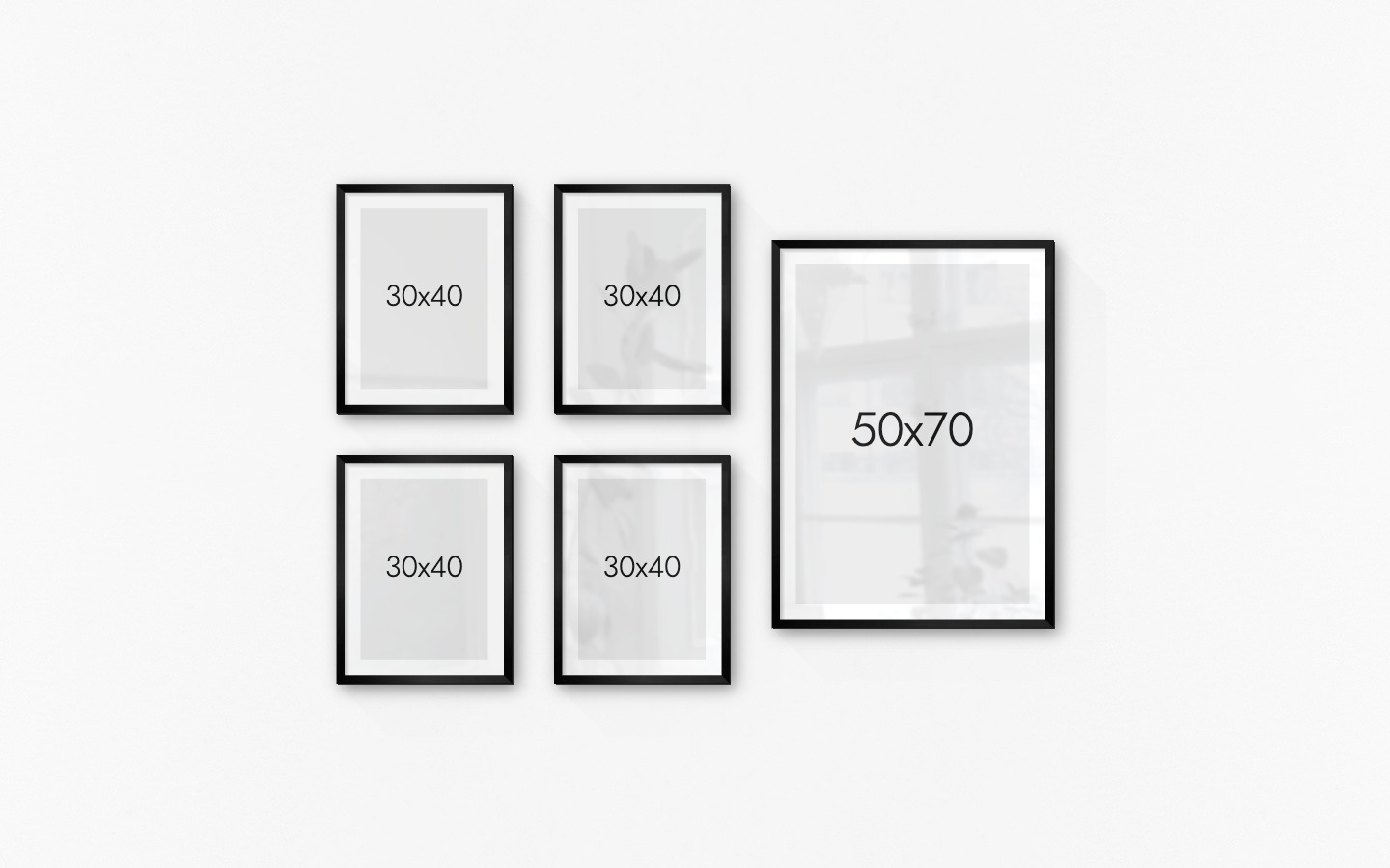 Gallery wall with picture frames in black in sizes 50x70 and 30x40